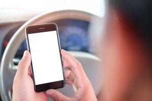 driver looking at cell phone