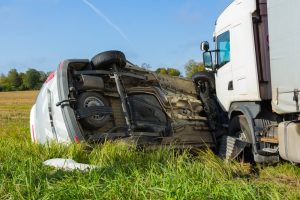 accident between truck and overturned car