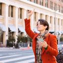 woman hailing rideshare-driver