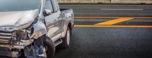 crushed bumper on silver truck