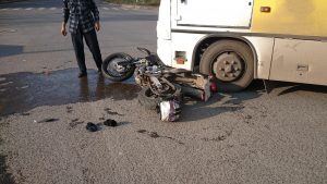 bus hitting motorcycle