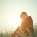 young-woman-crying-in-a-field