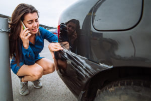 woman calling for help after car crash