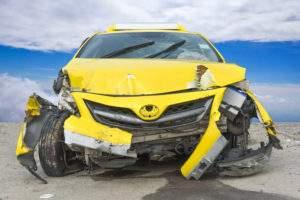 totaled yellow sportscar