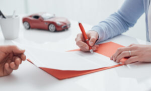 car insurance agent filling out claim form