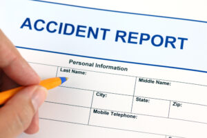 person filling out accident report