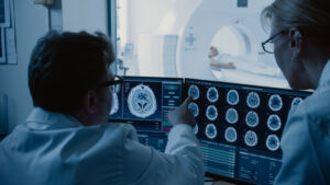 doctors reviewing a brain scan