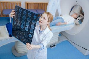 female radiologist looking at mri scan