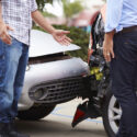 Drivers discussing what to do if you get a lowball insurance offer after an Atlanta car crash.