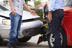 Drivers discussing what to do if you get a lowball insurance offer after an Atlanta car crash.