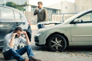 Man near accident scene calls lawyer to find out if he is liable if he rear-ended someone who stopped suddenly.