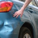 A person looking at their vehicle after a hit-and-run. Find out how the police investigate hit-and-runs in Georgia with a legal professional.